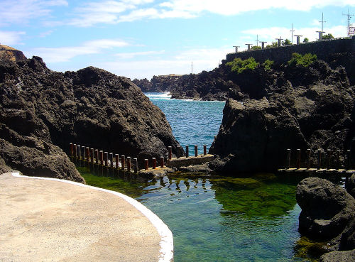 A natural pool in the middle of volcanic rock